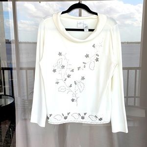 Stylish top with embellished detail.